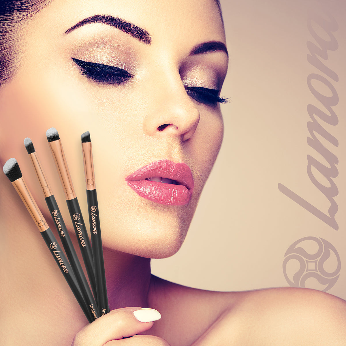 Beautiful woman holding brushes used to apply eyeshadow